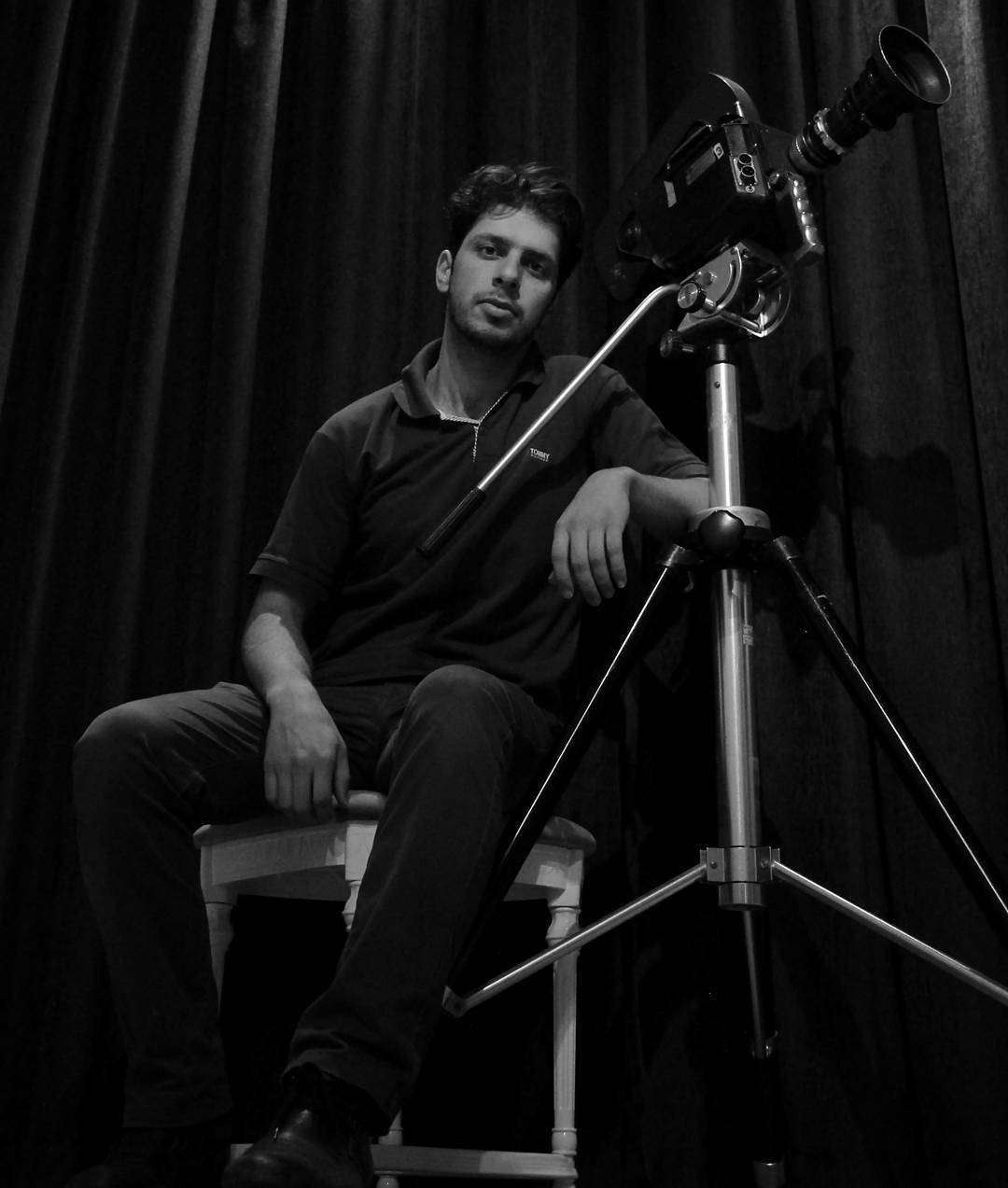 Hadi Alizadeh beside a vintage film camera, 2016